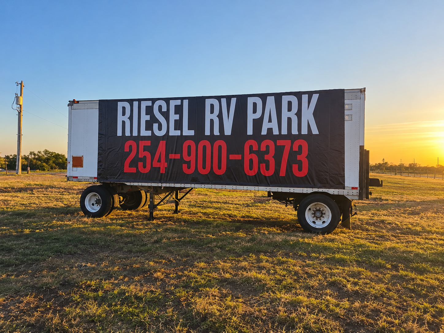 Riesel RV Park sign with phone number